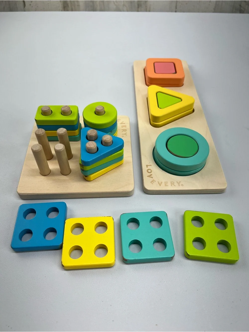 Lovevery Lot of 2 Puzzles Geo Shapes and Sort & Stack Peg Puzzle Montessori Toys